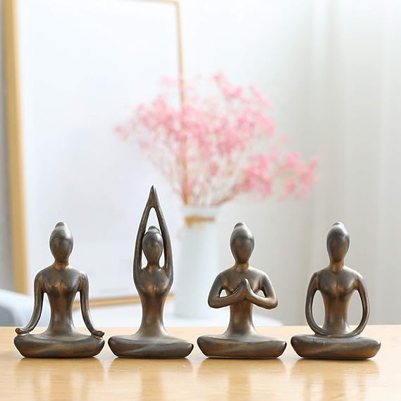 Set of four ceramic yoga figurines